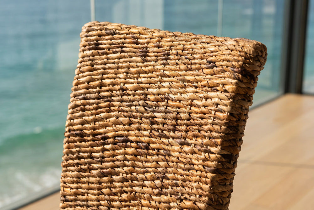 Close-up of the Briatico High-Back Woven Natural Fiber Dining Chair: weave