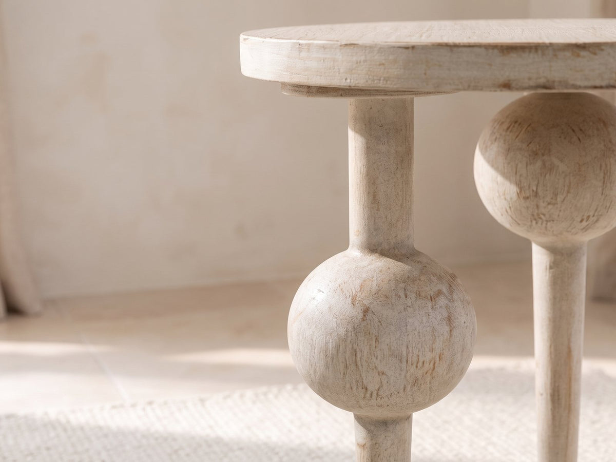 Close-up of the Brienza Reclaimed Pine Sphere-Leg Side Table: a turned leg swelling into a whitewashed pine sphere
