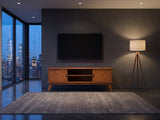 Brisighella Mid-Century Media Console under a wall-mounted screen in a city penthouse at blue hour