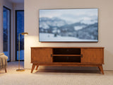 Brisighella Mid-Century Media Console under a screen showing a snowy landscape on a winter evening