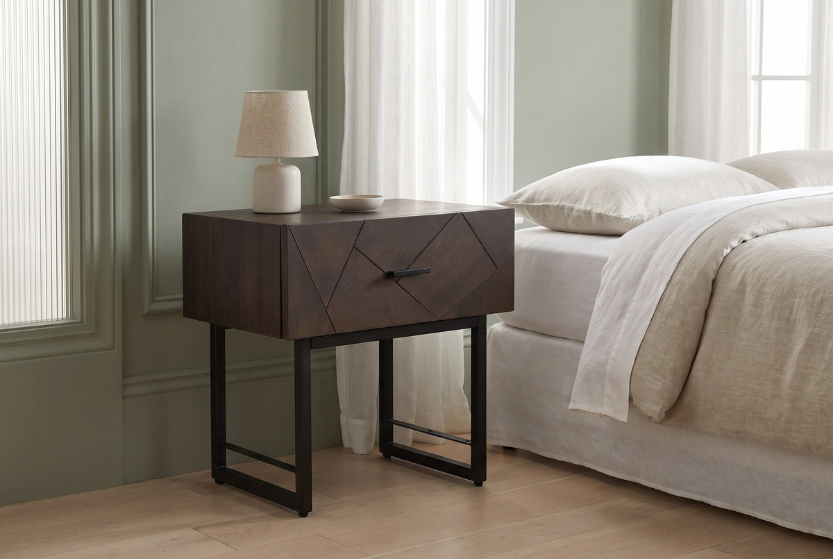 Budoni smoked oak nightstand against a sage green panelled wall in a Chicago greystone bedroom with sheer white curtains and pale maple floorboards