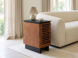 Buonvicino Bourbon and Black Slatted Side Table with a lamp and a ceramic bowl beside a cream boucle sofa in a bright plaster room