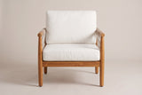 The Burgio club armchair seen from the front: the cream back cushion and seat cushion between two round acacia arms on round legs