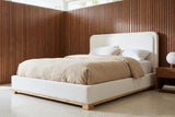 Bussi bed against walnut slat panelling in a Palm Springs mid-century bedroom with a terrazzo floor