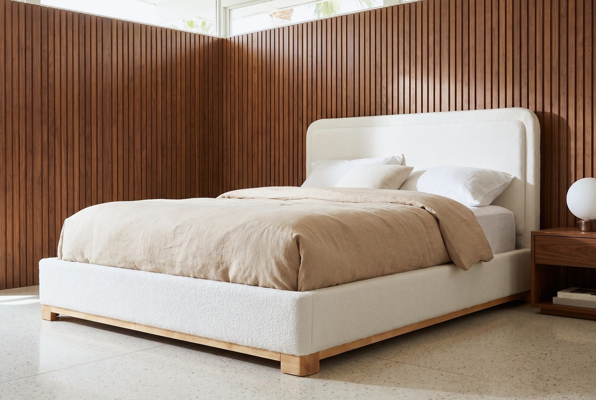 Bussi bed against walnut slat panelling in a Palm Springs mid-century bedroom with a terrazzo floor