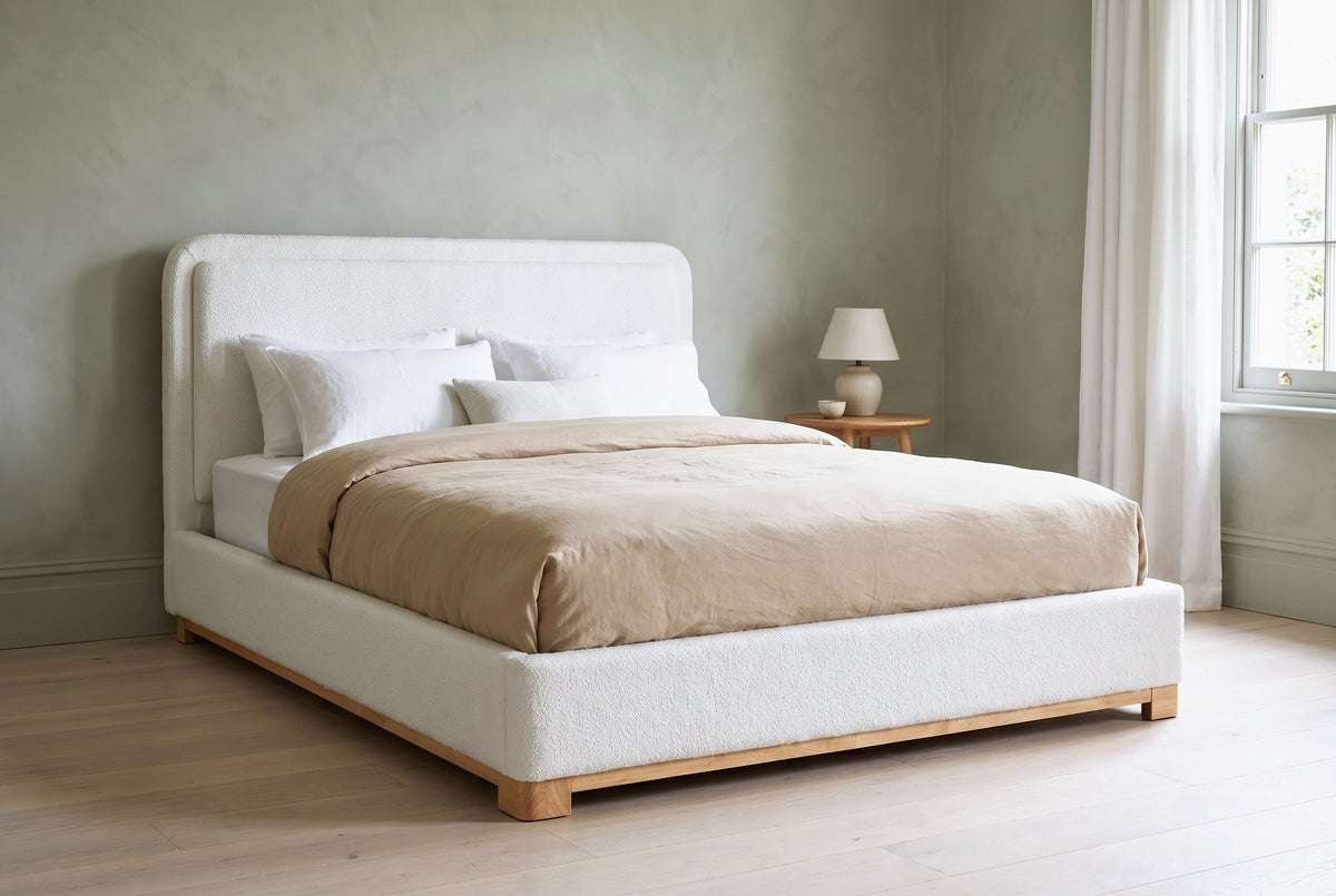 Bussi bed against a sage green limewash wall in a Savannah townhouse bedroom with pale oak floors