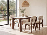 Caccuri 63-Inch Sintered Stone Walnut-Finish Dining Set with 4 Chairs in a sunlit villa dining area with olive trees outside