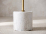 Close-up of the Calimera Black Mango and Marble Pedestal Side Table: the brass rod and collar rising from the white marble base