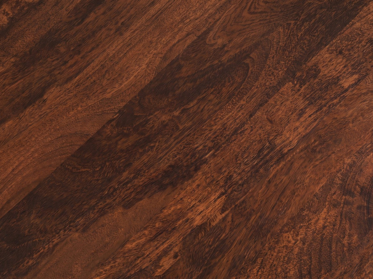 Close-up of the Camaiore Faceted Mango Drum Coffee Table: the walnut brown mango figure of the round top