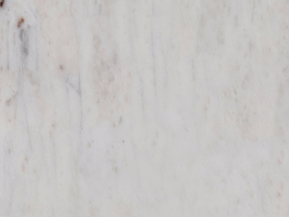Close-up of the Camogli Marble and Black Metal Drum Side Table: the soft grey veining of the white marble top