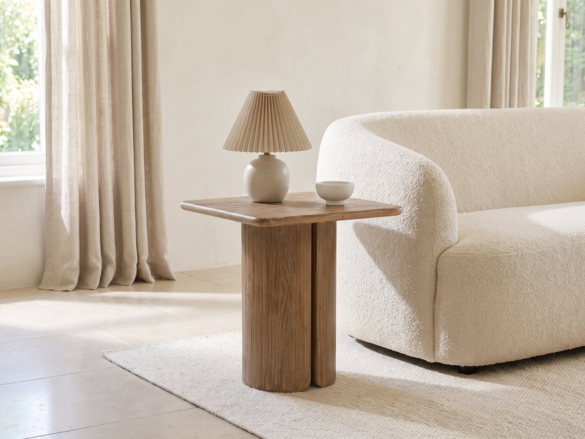 Campli Reclaimed Pine Split Pedestal Side Table with a lamp and a ceramic bowl beside a cream boucle sofa in a bright plaster room