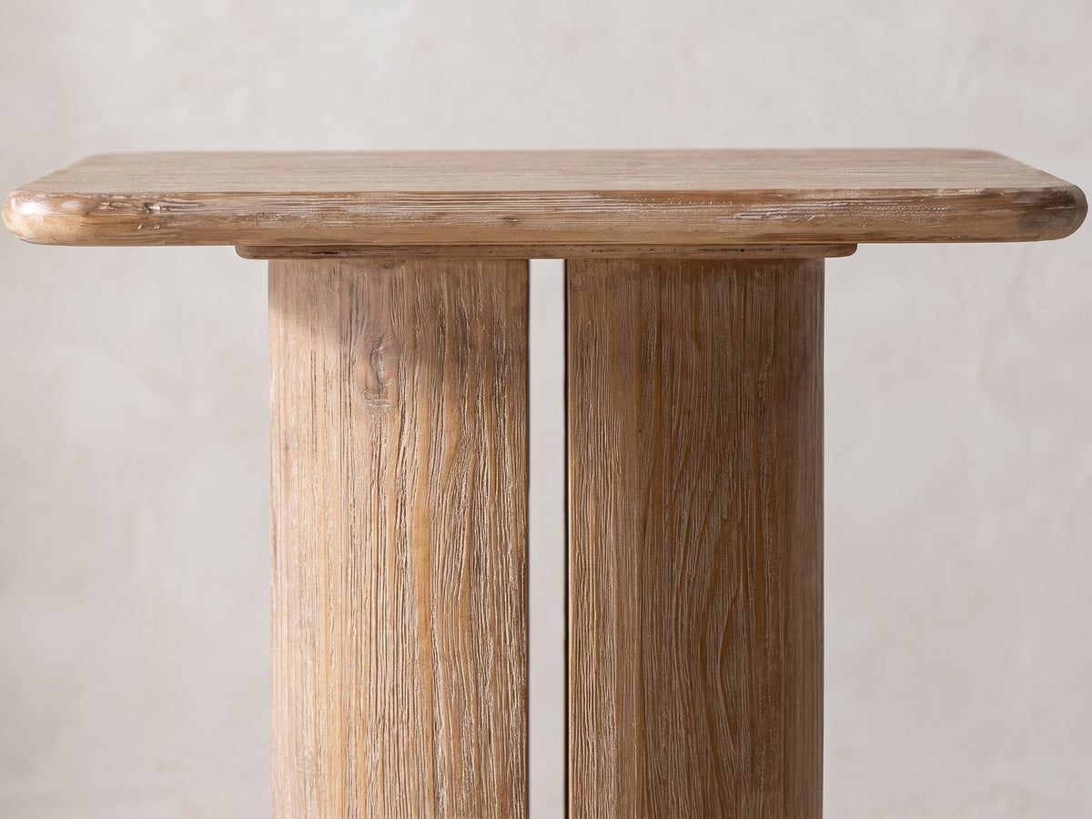 Close-up of the Campli Reclaimed Pine Split Pedestal Side Table: the rounded pine top over the split pedestal