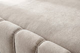 Close-up of the beige chenille on the Capracotta bed: a deep stitched groove between two plump channels
