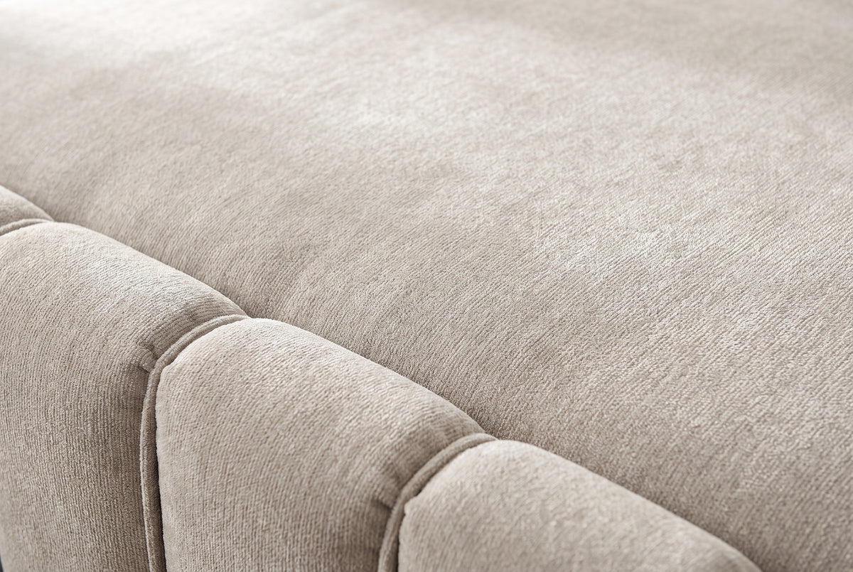 Close-up of the beige chenille on the Capracotta bed: a deep stitched groove between two plump channels