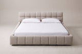 Capracotta floor bed in beige chenille with a white mattress and pillows (not included), front view
