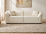 Capri Curved Boucle Sofa in a bright interior