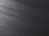 Close-up of the Caramanico Black Mango Tapered Drum Side Table: the black-finished mango grain of the top