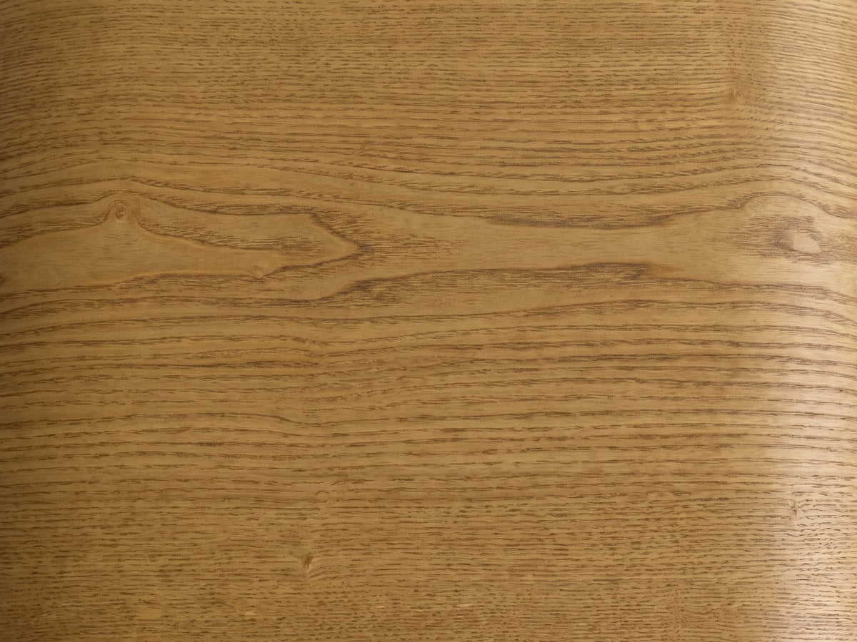 Close-up of the Cariati Ash Veneer Curved-Top Side Table: the honey-brown ash grain of the top