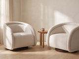 Two Carina swivel chairs facing each other with a small table between them