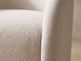 Close-up of the boucle texture and welted edge