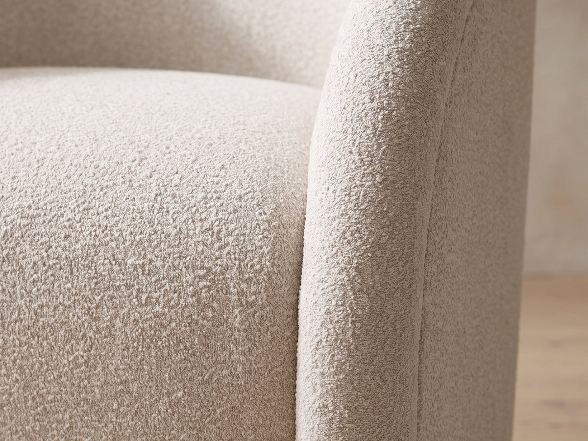 Close-up of the boucle texture and welted edge