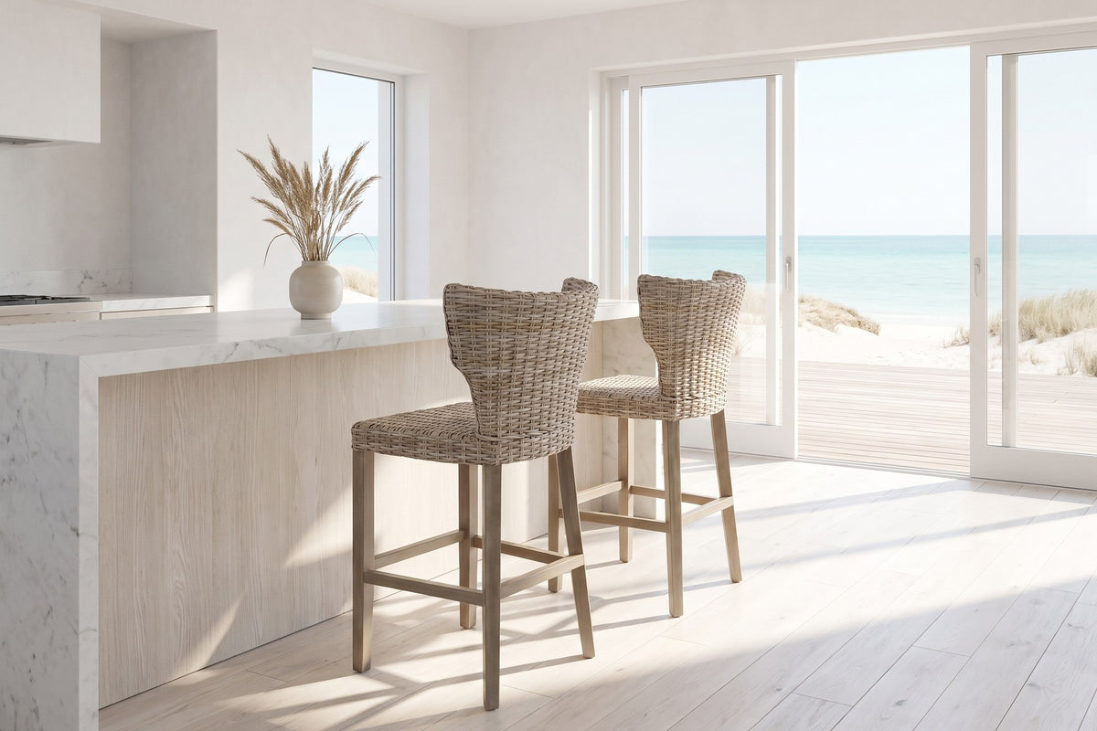 Carlopoli Wing-Back Grey Kubu Rattan Counter Stool in an oceanfront glass house