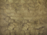 Close-up of the Carovilli Hammered Metal Drum Side Table: the hand-hammered antique gold surface
