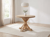 Casabona 42-Inch Round Fir Baluster Pedestal Dining Table in a bright plaster dining room with linen curtains
