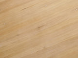 Close-up of the Casabona 42-Inch Round Fir Baluster Pedestal Dining Table: the natural fir top with small knots
