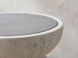 Close-up of the Casarano Fiber Concrete Hourglass Side Table: the grey concrete top inside the textured off-white rim