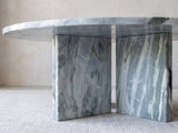 Close-up of the Cascia Compact Blue-Grey Marble Coffee Table: the two blue-grey marble slabs of the base meeting under the top