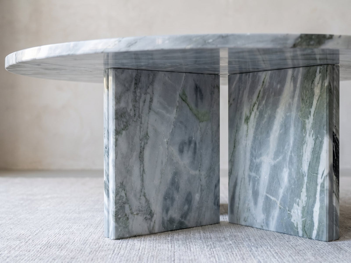 Close-up of the Cascia Compact Blue-Grey Marble Coffee Table: the two blue-grey marble slabs of the base meeting under the top