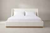 Casoli white boucle winged bed with a white mattress and pillows (not included), front view