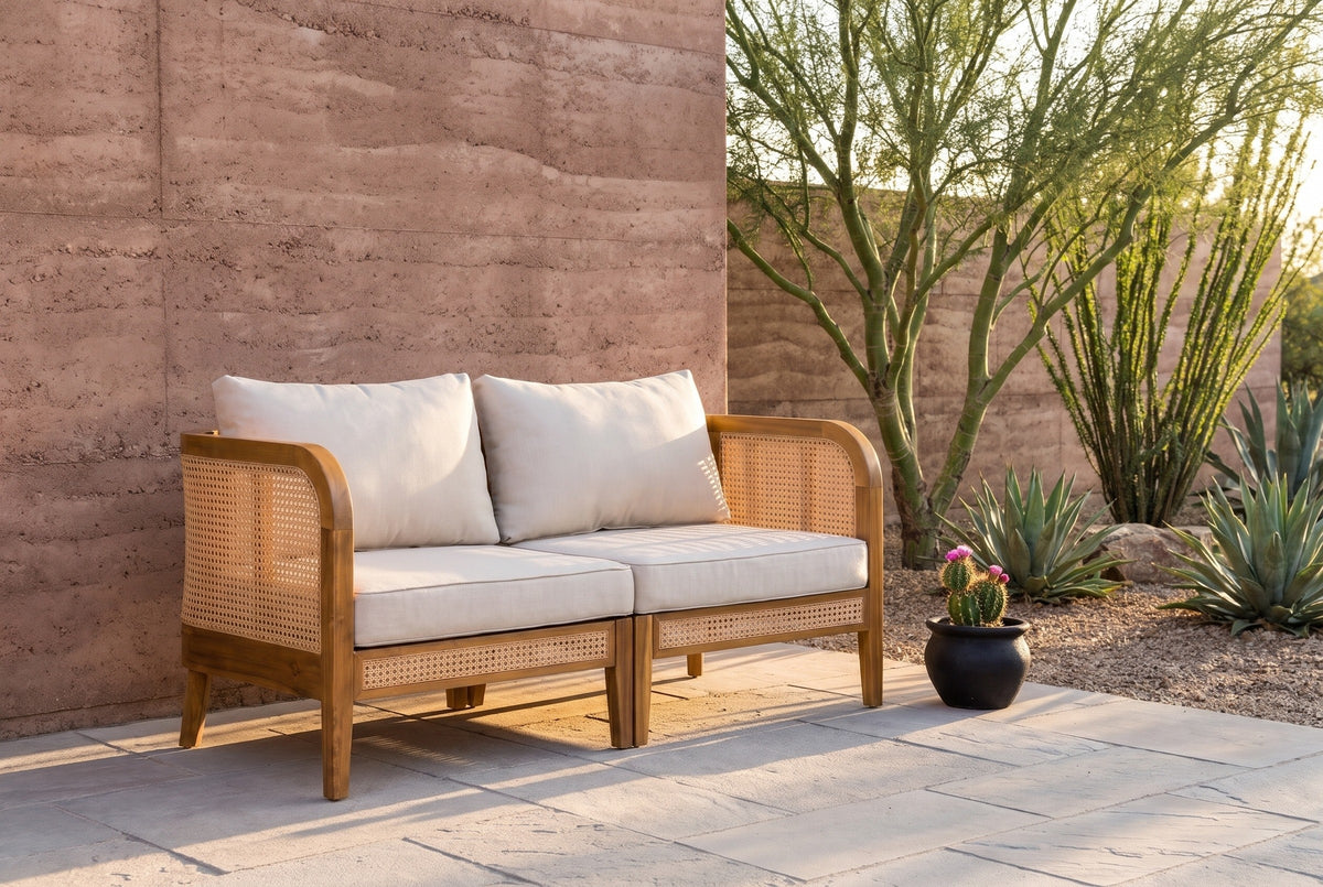 Castelbuono arm chairs joined on a Tucson desert patio with a rammed-earth wall, flagstones, a palo verde tree and agaves (planter not included)