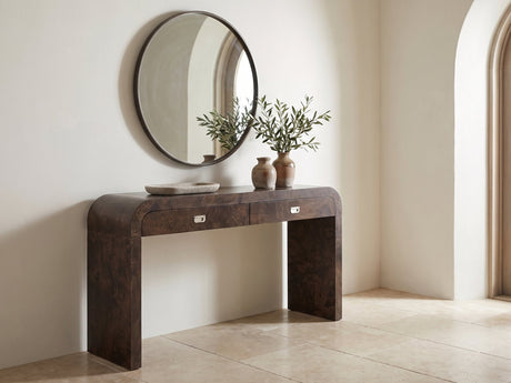 Castellana Burl Veneer Waterfall Console Table under a round mirror in a travertine entryway