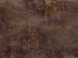Close-up of the Castellana Burl Veneer Waterfall Console Table: the dark poplar burl veneer of the top