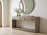 Castellaneta Knotty Oak Veneer Console Table under a round mirror in a travertine entryway