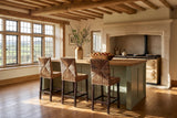 Castrolibero Woven Natural Fiber and Dark Wood Counter Stool in an English country dining room