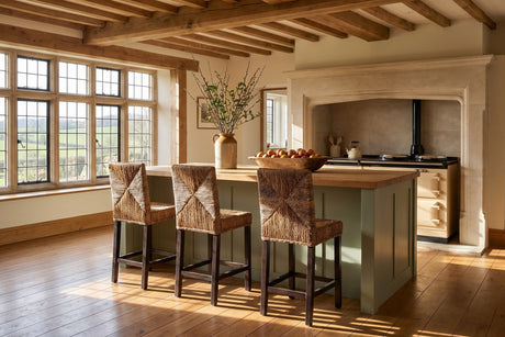 Castrolibero Woven Natural Fiber and Dark Wood Counter Stool in an English country dining room