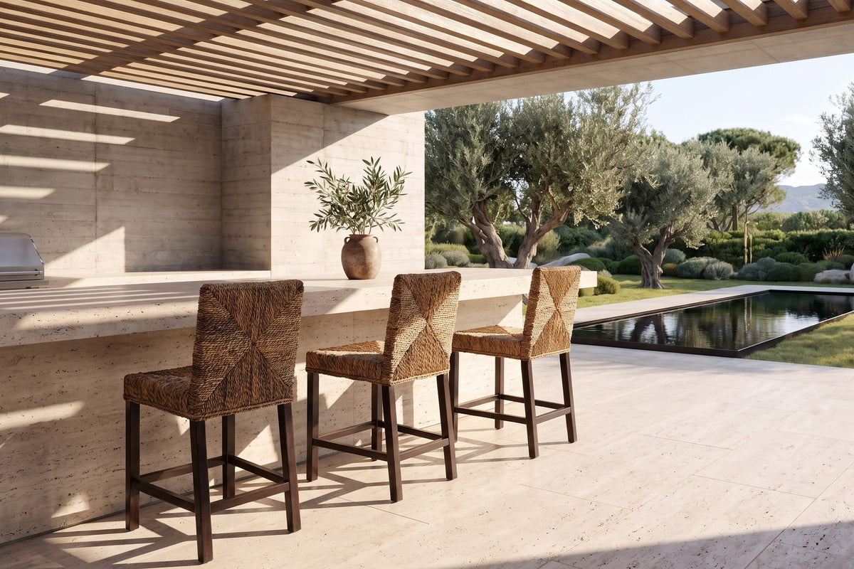 Castrolibero Woven Natural Fiber and Dark Wood Counter Stool in a sunlit villa dining room