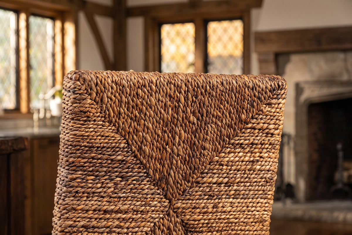 Close-up of the Castrolibero Woven Natural Fiber and Dark Wood Counter Stool: weave