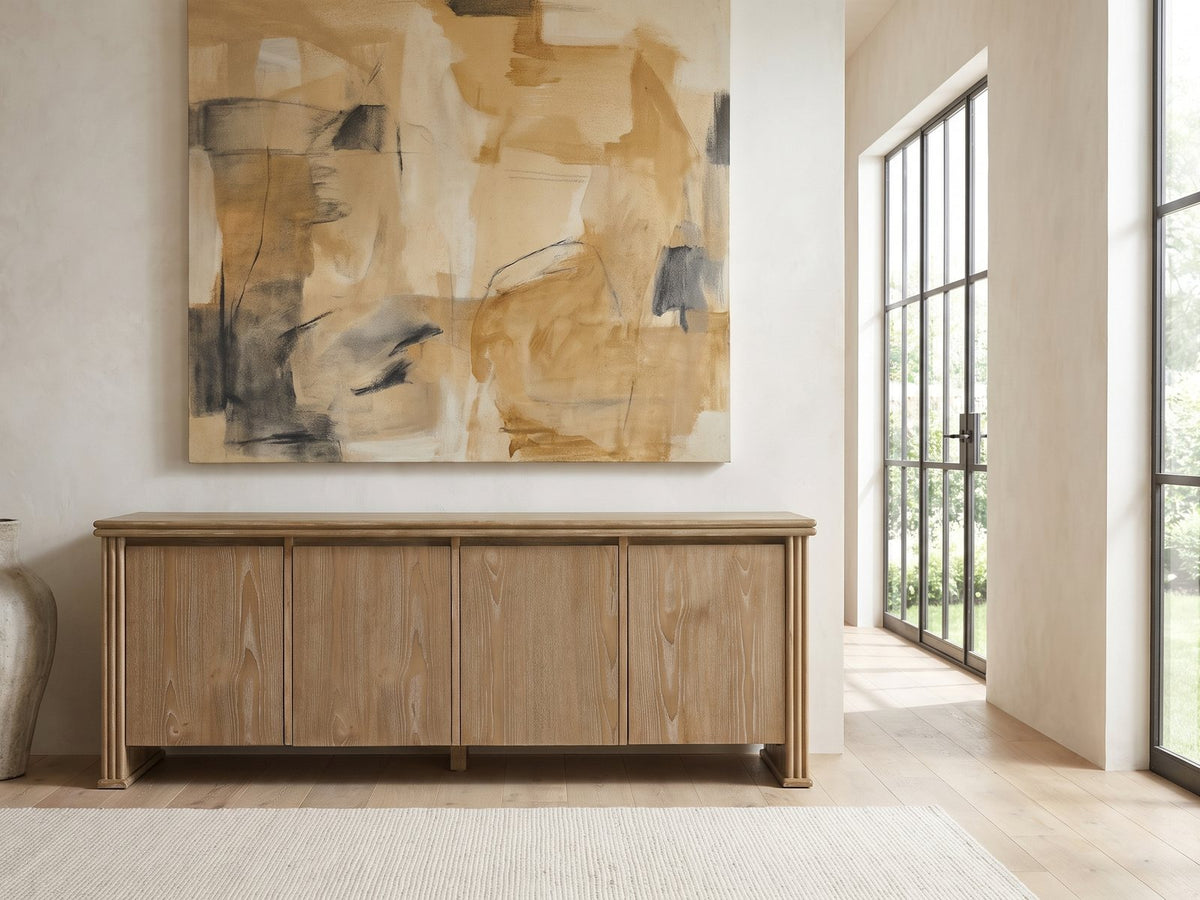 Cefalu Fluted Oak Media Console under a large abstract painting in a bright living room