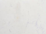 Close-up of the Ceglie White Marble Hourglass Side Table: the white Banswara marble of the top