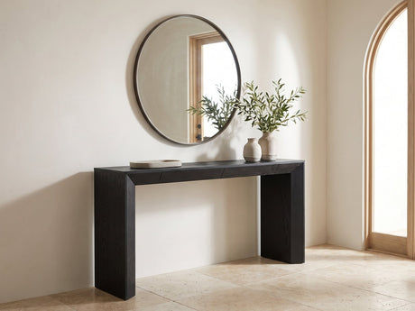 Cellamare Black Ash Veneer Waterfall Console Table under a round mirror in a travertine entryway