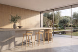 Cervicati 26.5-Inch Solid Ash Low-Back Counter Stool in a sunlit villa dining room