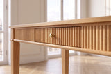 Close-up of the Cessaniti 63-Inch 1-Drawer Reeded Rubberwood Writing Desk: reeding