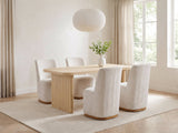 Cetraro 68.75-Inch Fluted Leg Dining Set with 4 Upholstered Chairs in a bright plaster dining room with linen curtains