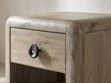 Close-up of the Chiaromonte Knotty Oak Veneer Two-Drawer Side Table: the rounded corner, top drawer and sculpted ring pull