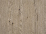 Close-up of the Chiaromonte Knotty Oak Veneer Two-Drawer Side Table: the knotty oak veneer of the top