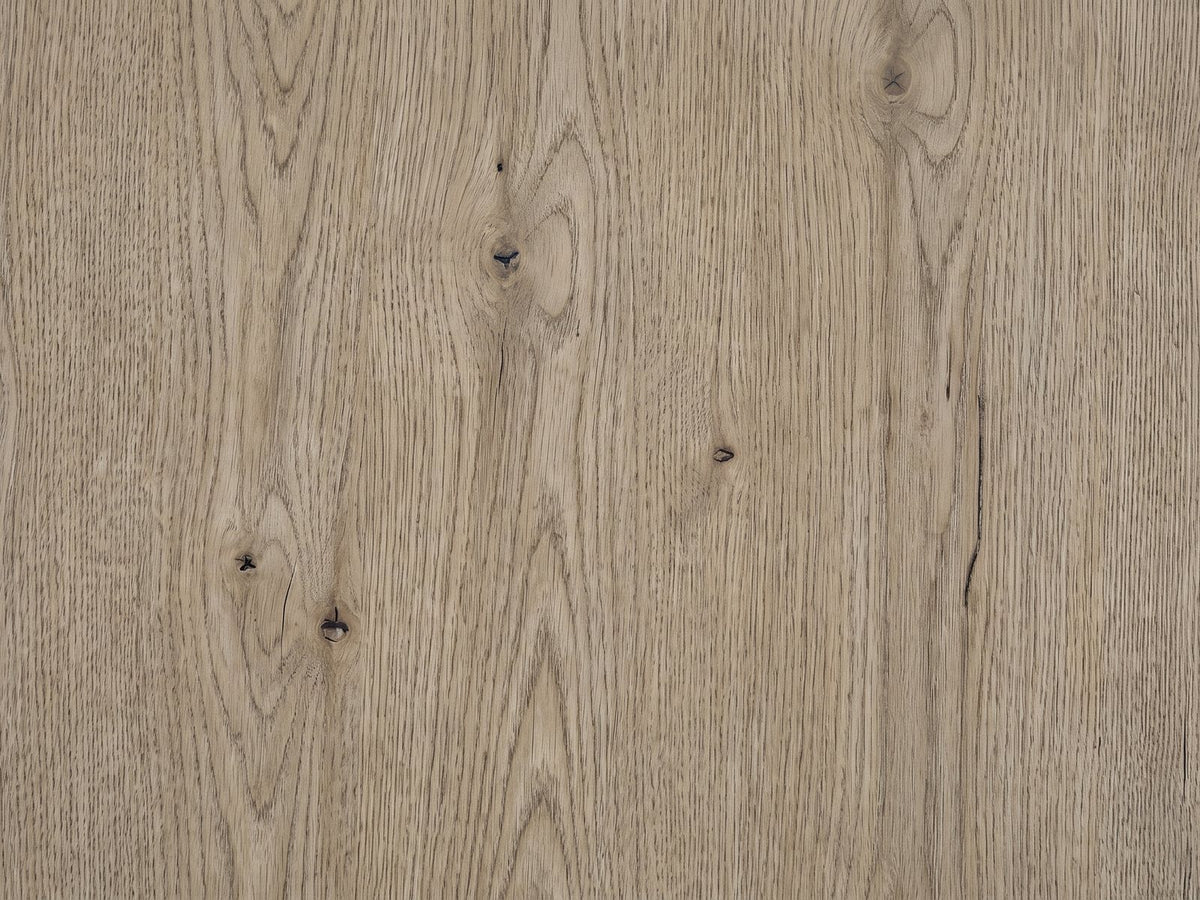 Close-up of the Chiaromonte Knotty Oak Veneer Two-Drawer Side Table: the knotty oak veneer of the top